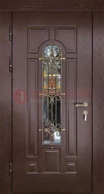 Темная железная дверь со стеклом и ковкой для частного дома ДСК-156 в Зеленограде